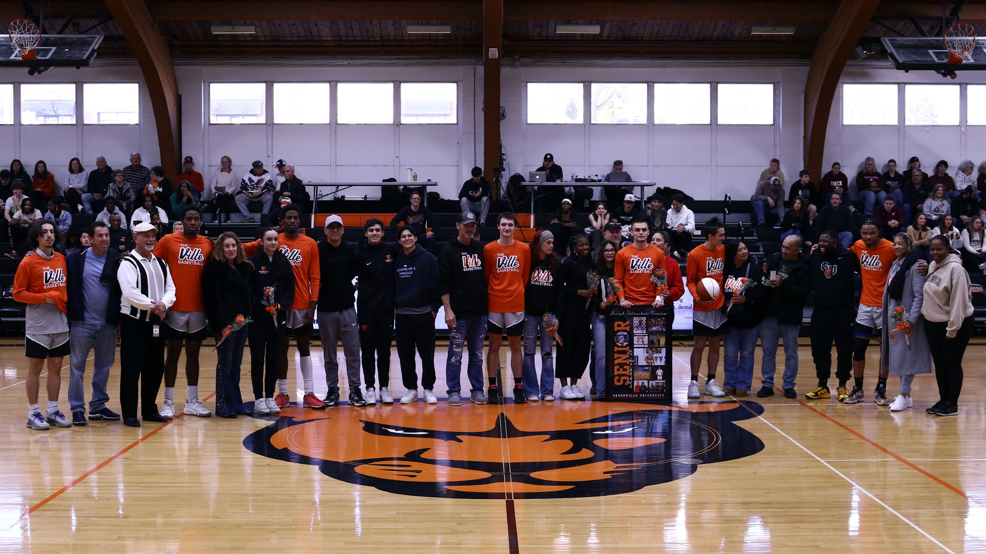 group picture of mens bball seniors with parents