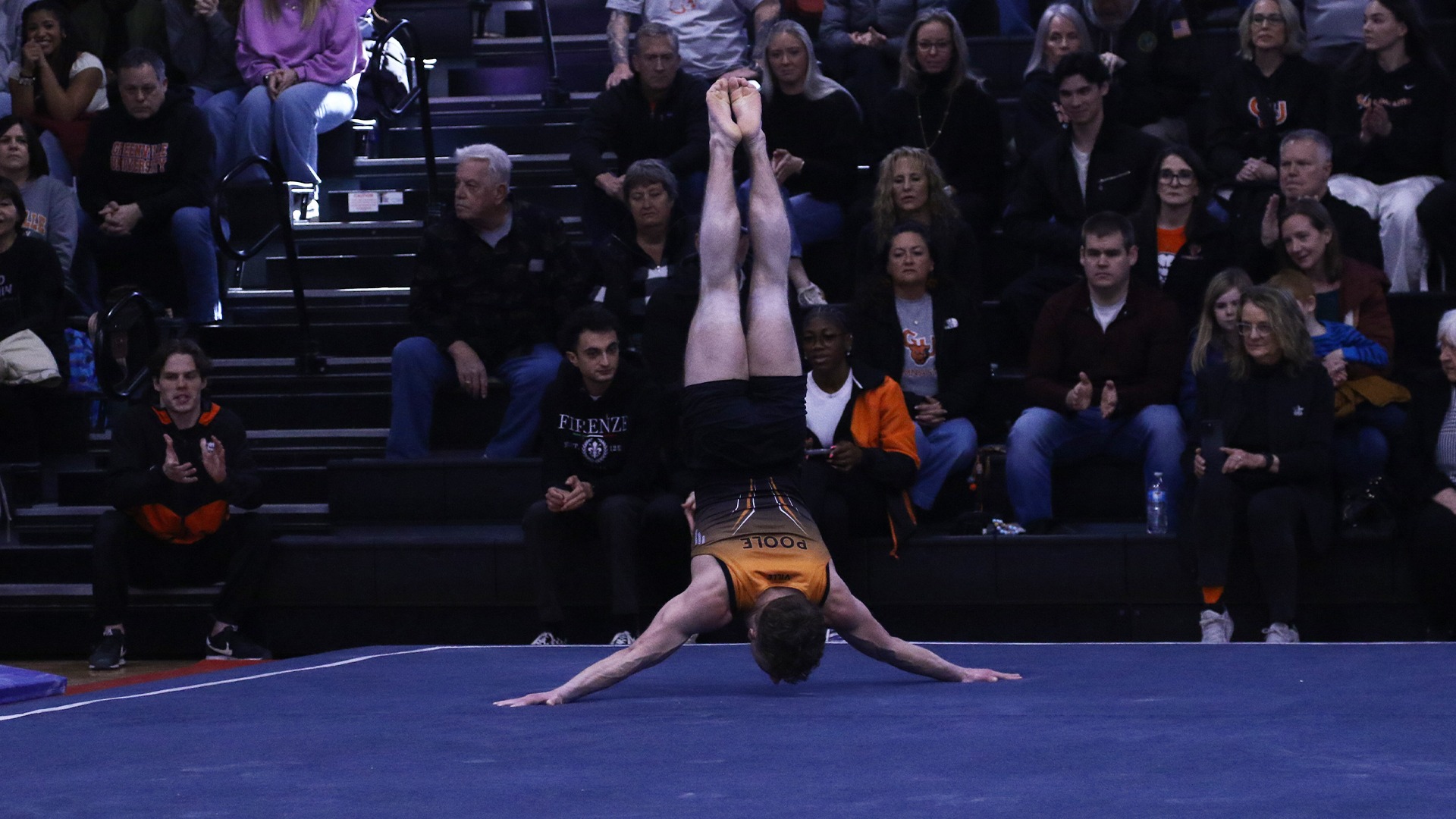 Ethan Poole in wide handstand on floor exercise