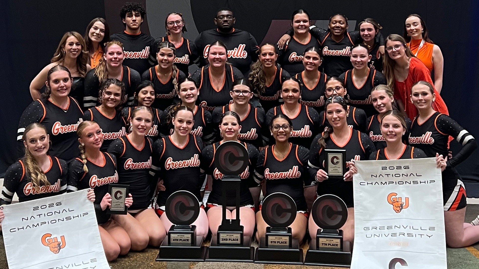 program group pic after nationals holding four trophies