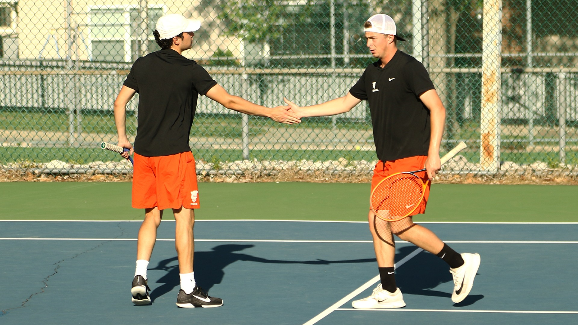 Hulme and Sanabria highfiving on court