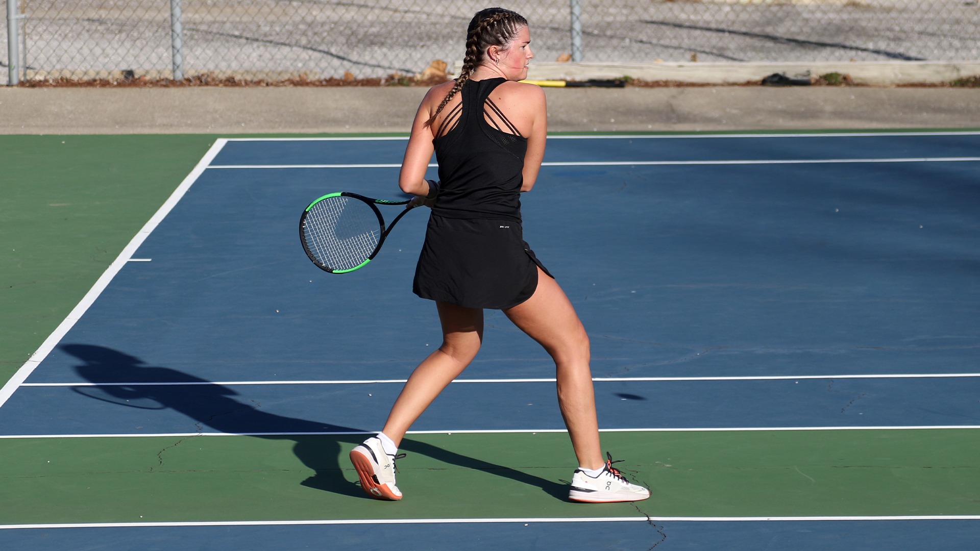Lily Gregory hitting forehand