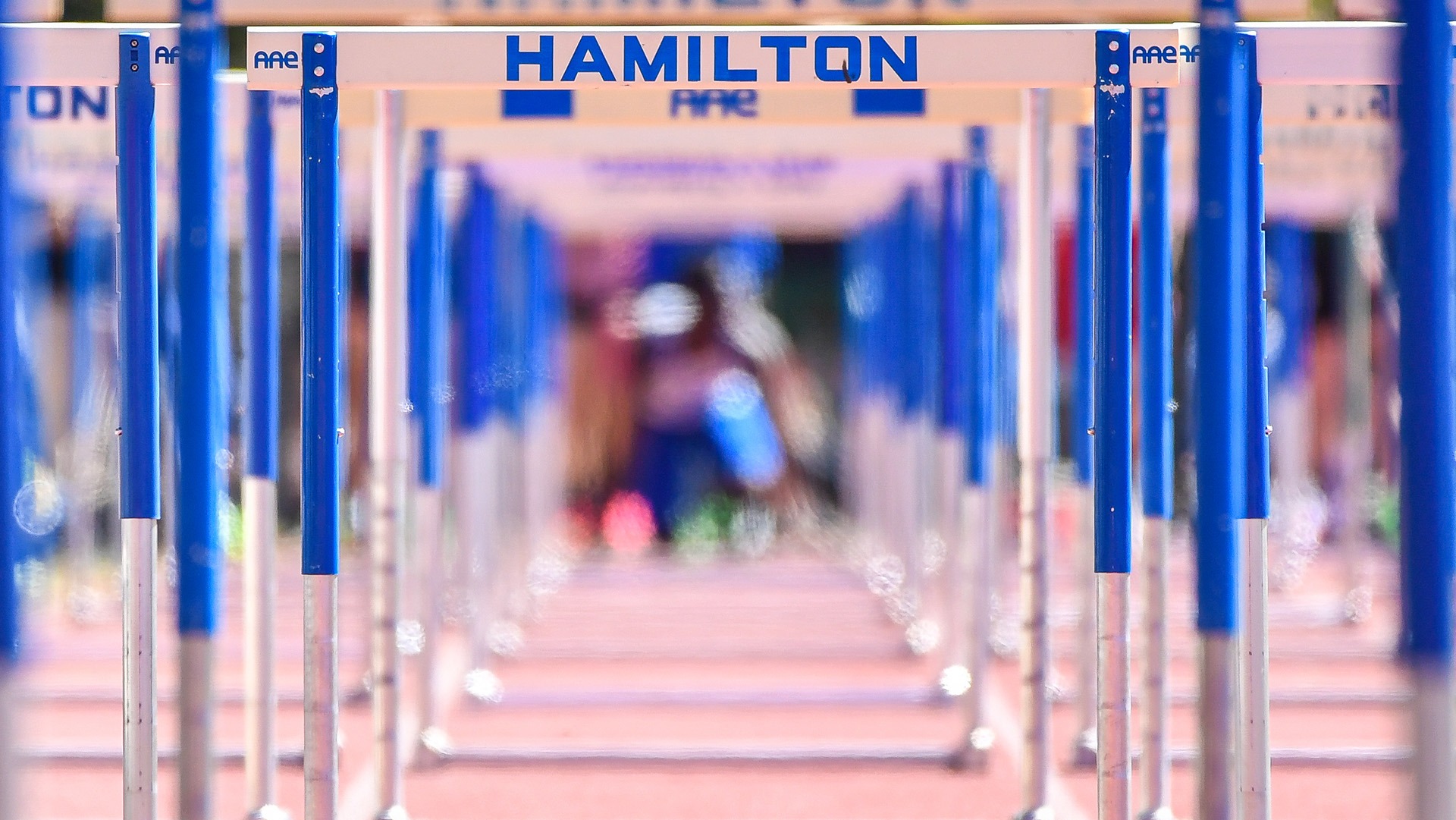 Two men's track and field athletes compete at Fast Chance Meet