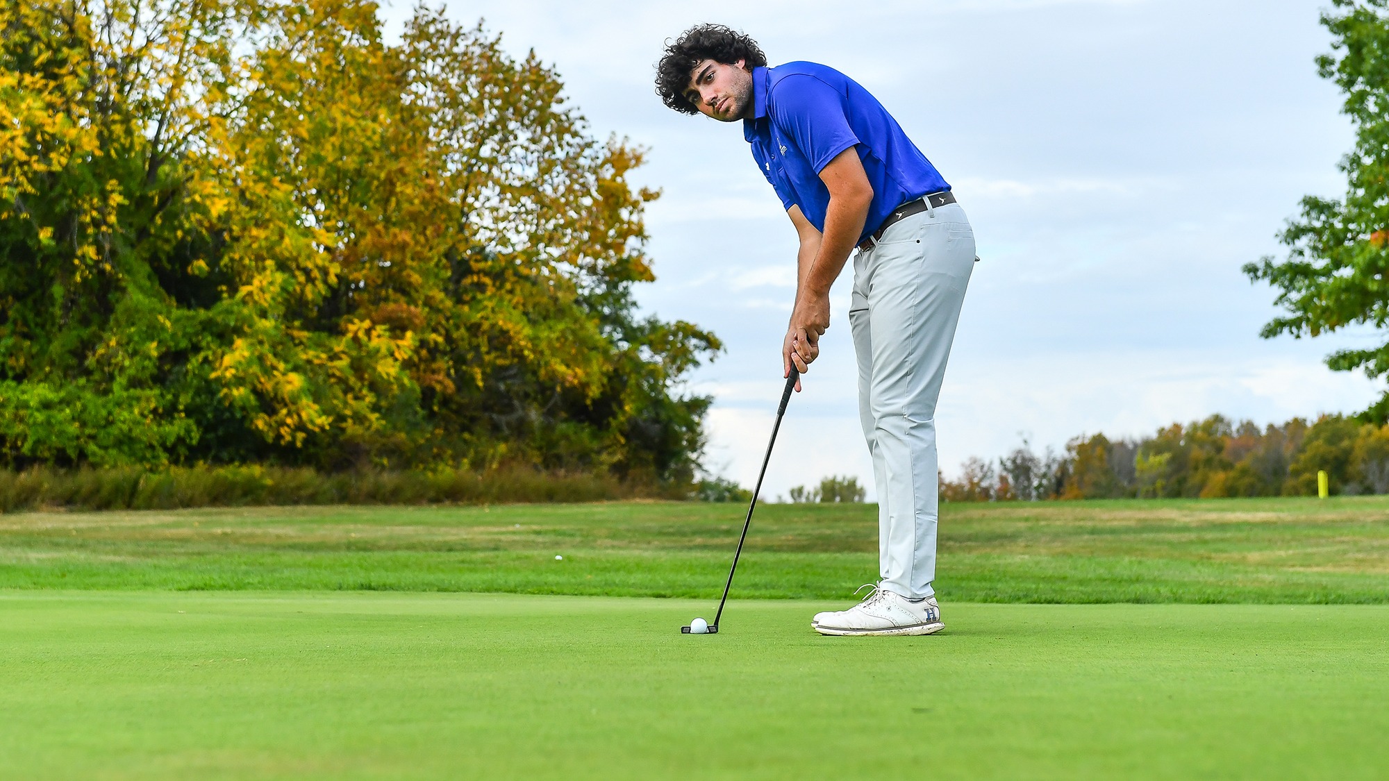 Ramon Aroca Gonzalez looks at the hole before putting during practice in September 2025