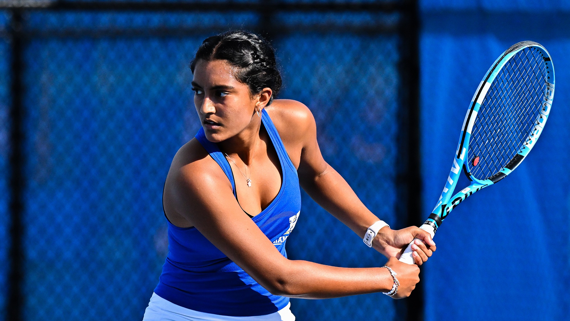 Priyanka Challapalli reaches back to hit a backhand return during practice in September 2025