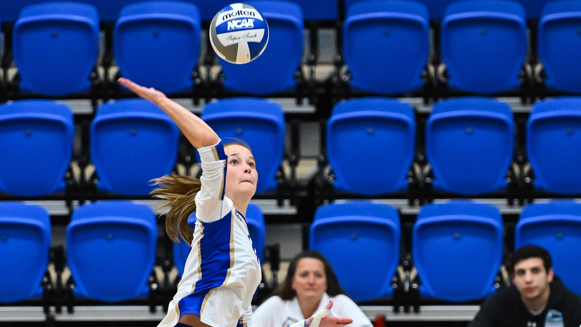 Elodie McGeiver reaches back to spike the volleyball against Wesleyan in October 2025 