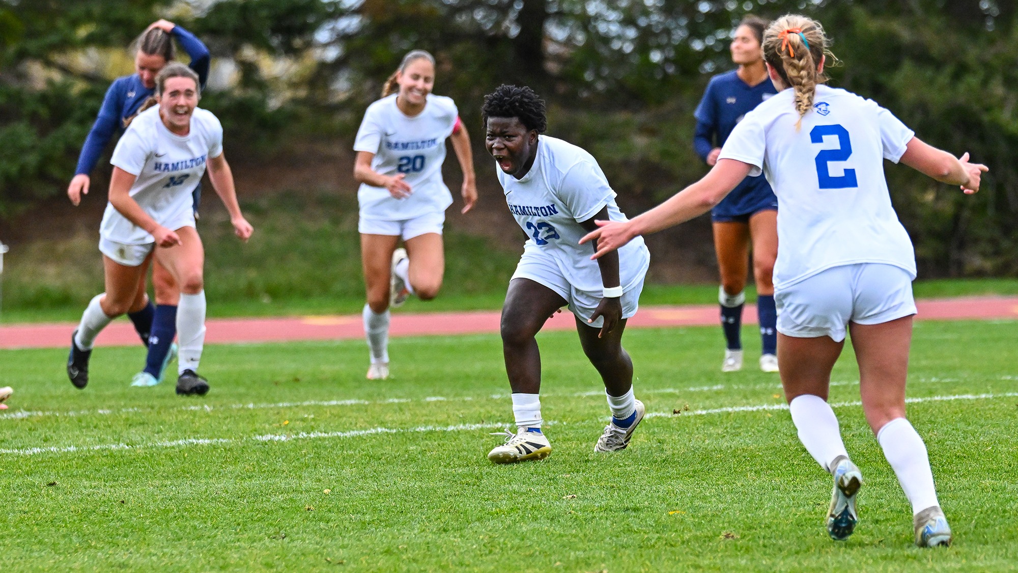 Women's Soccer players celebrate a goal by Diana Baffor late against Trinity in October 2025
