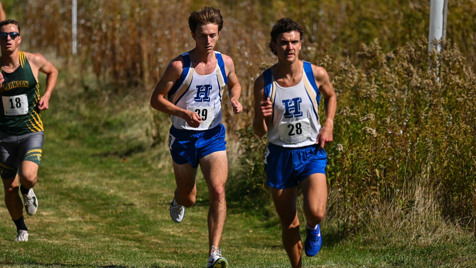 Jack Quinn follows Liam Card closely midway through the 2025 Hamilton Cross Country Invitational in October 2025