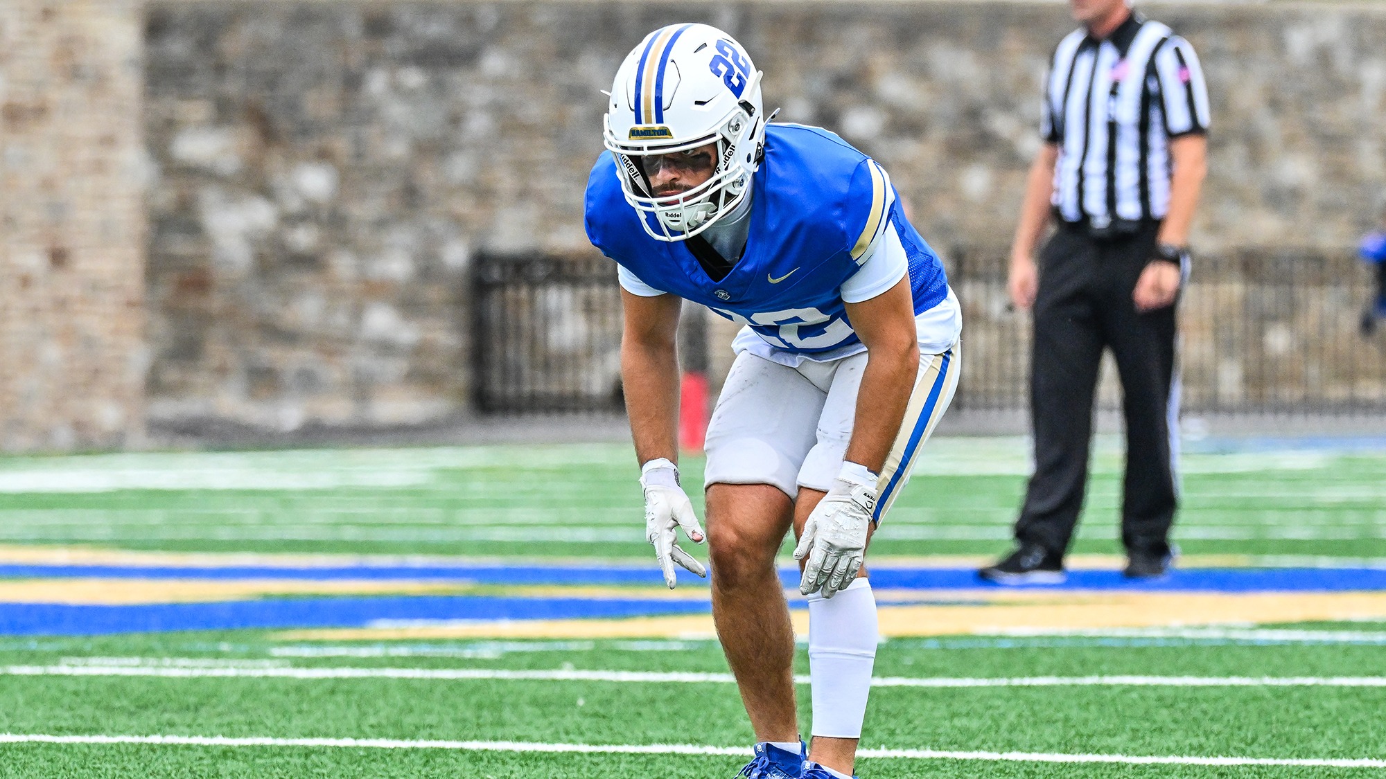 Tani Smart waits in the defensive backfield for the football to be snapped by Williams in September 2025