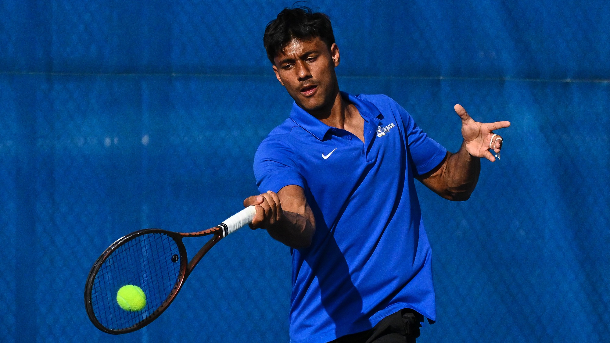 Tarun Korwar hits a forehand return during practice in September 2025