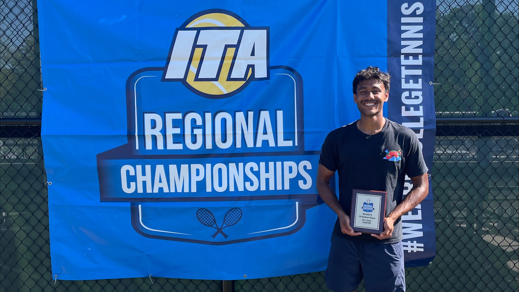 Men's tennis player Tarun Korwar poses with his champion plaque after winning the 2025 ITA Northeast Regional Championships