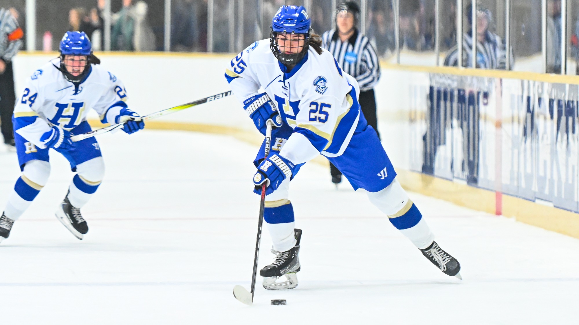 Sarah Myziuk brings the puck into the offensive zone against Trinity in November 2025