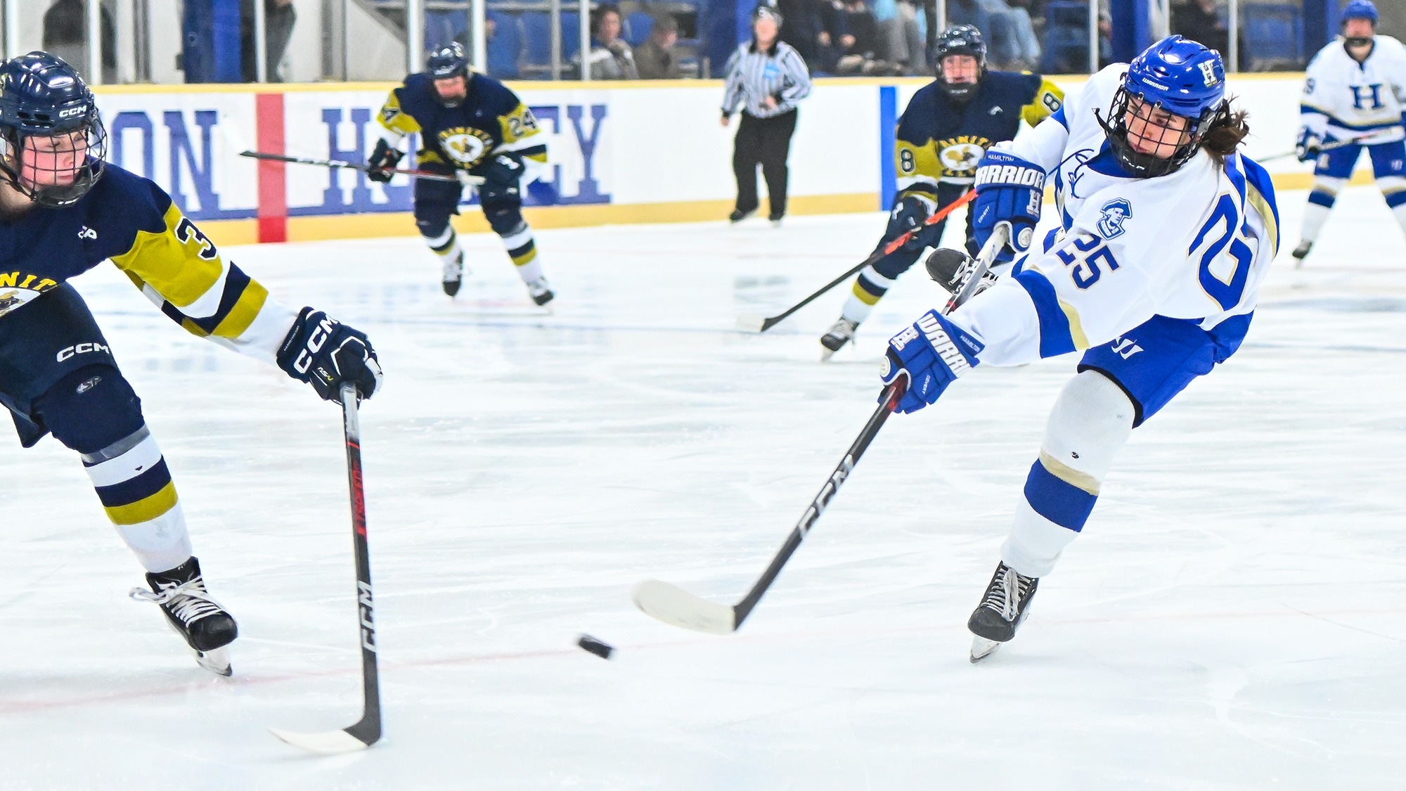 Sarah Myziuk '28 releases a wrist shot against Trinity in November 2025