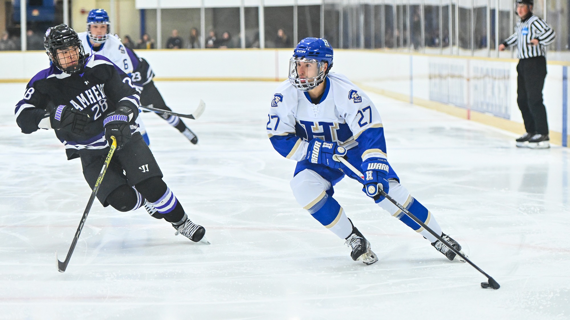 Luke Tchor looks to pass the puck from the left faceoff circle against Amherst in November 2025