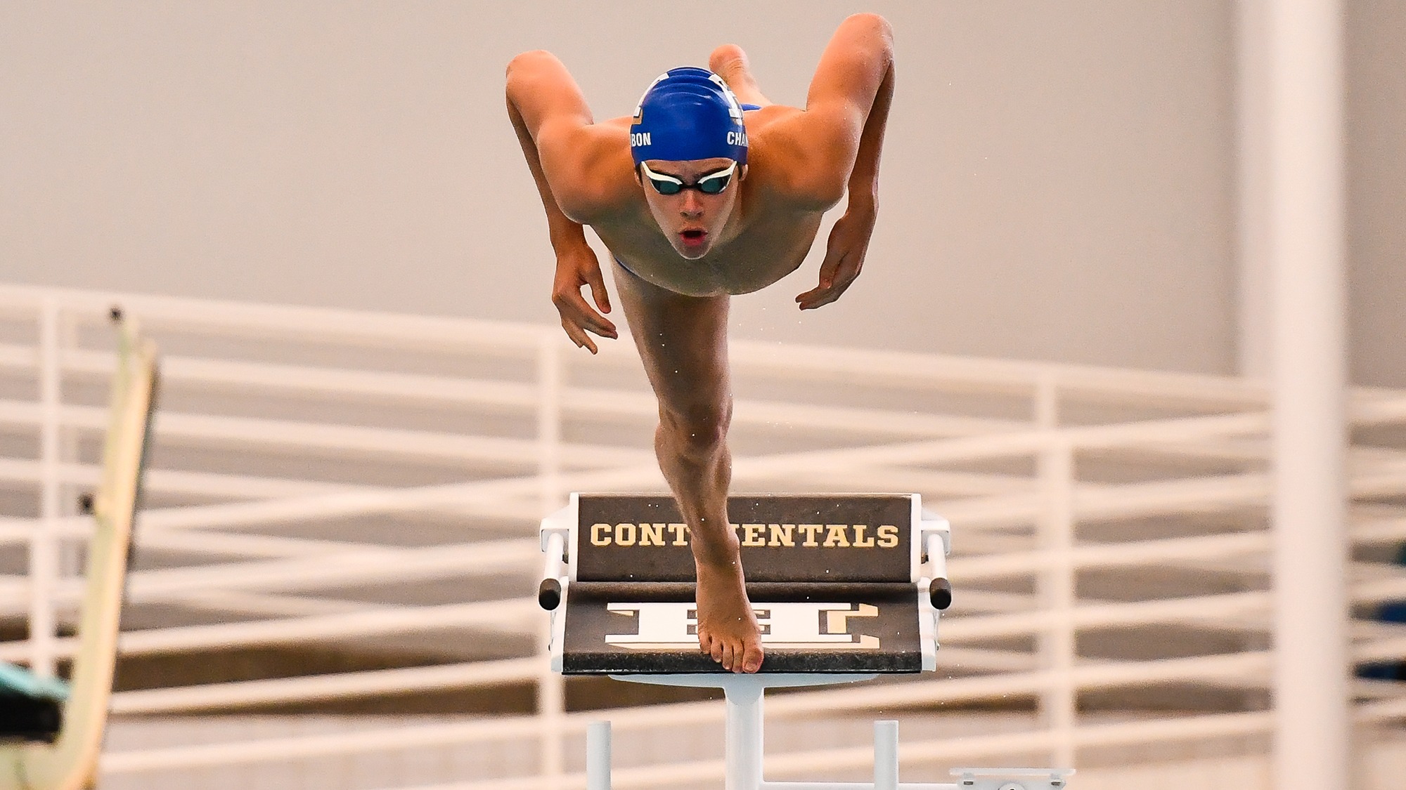 Loui Chambon on the starting blocks ready to jump in the pool during swim practice in January 2025