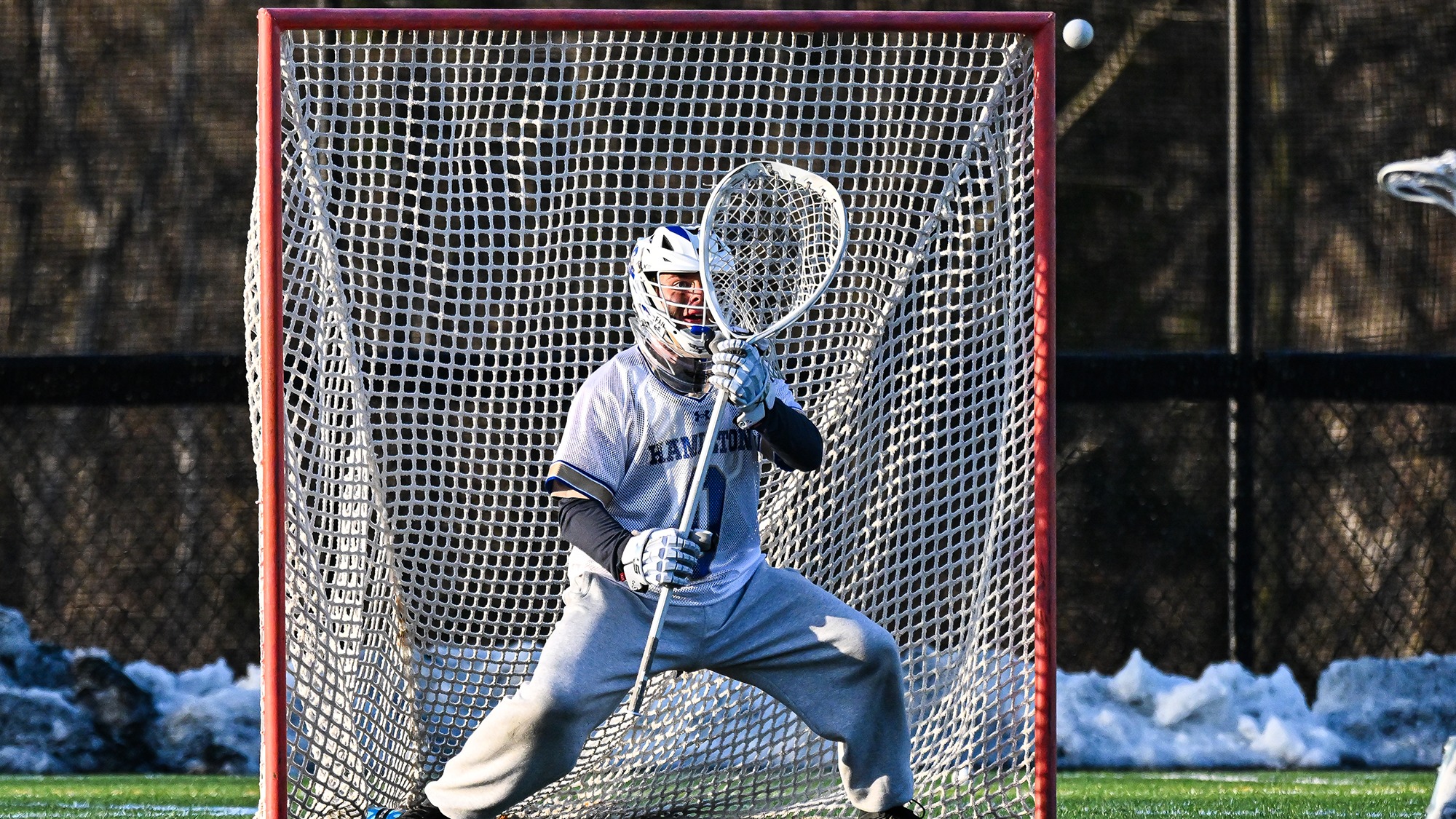 Jack Fried watches a shot into his goalie stick against Williams in April 2025