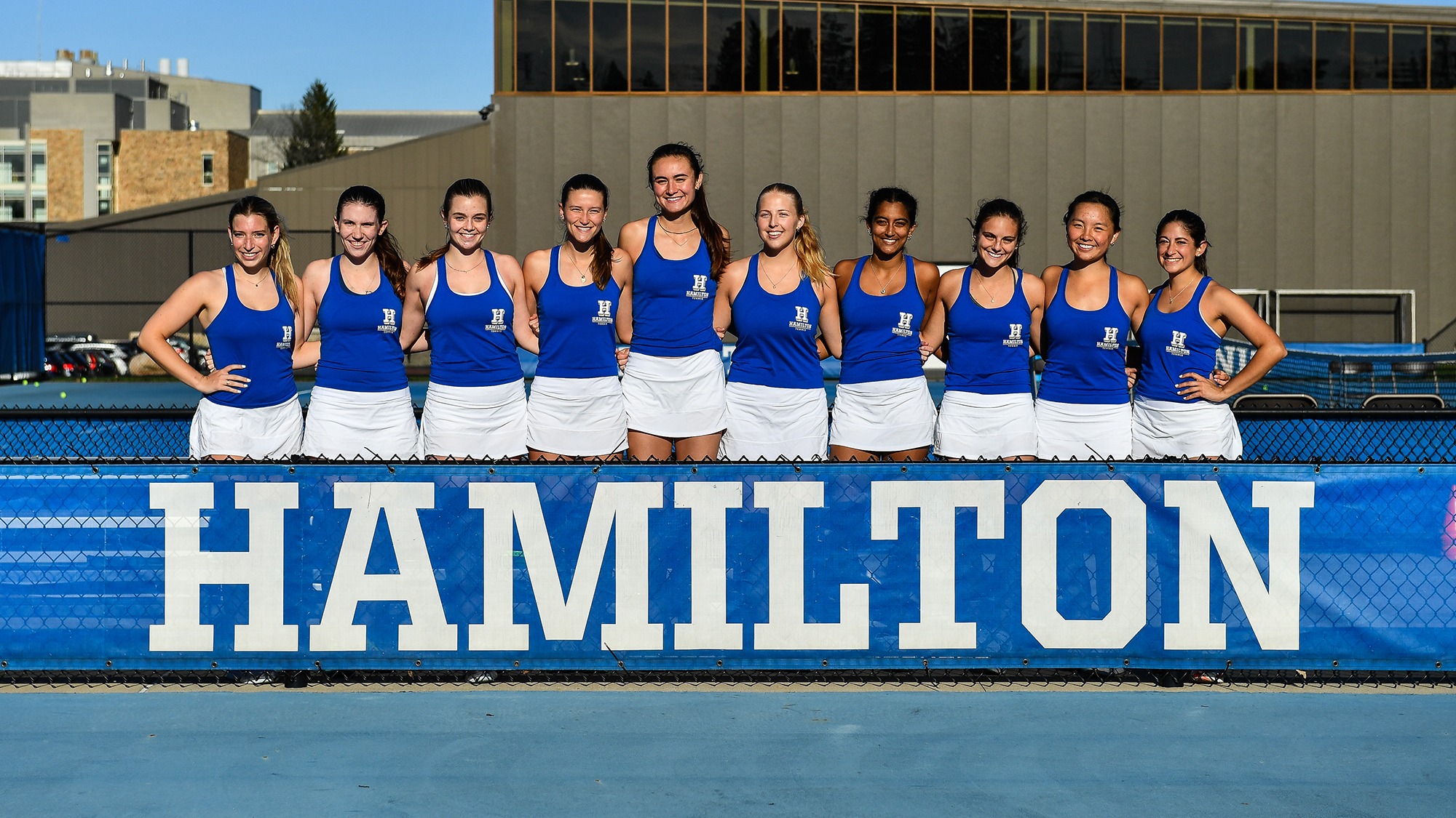 Women's Tennis team poses on Tietje Family Tennis Courts during practice in April 2025