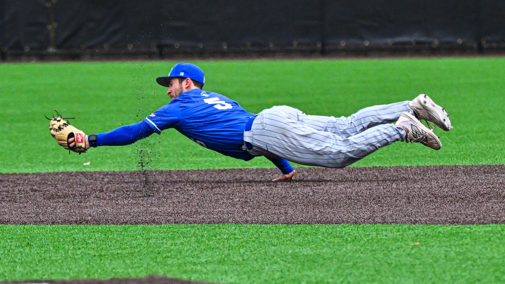 Greg Kopp dives for the ball at second base against Williams in April 2025