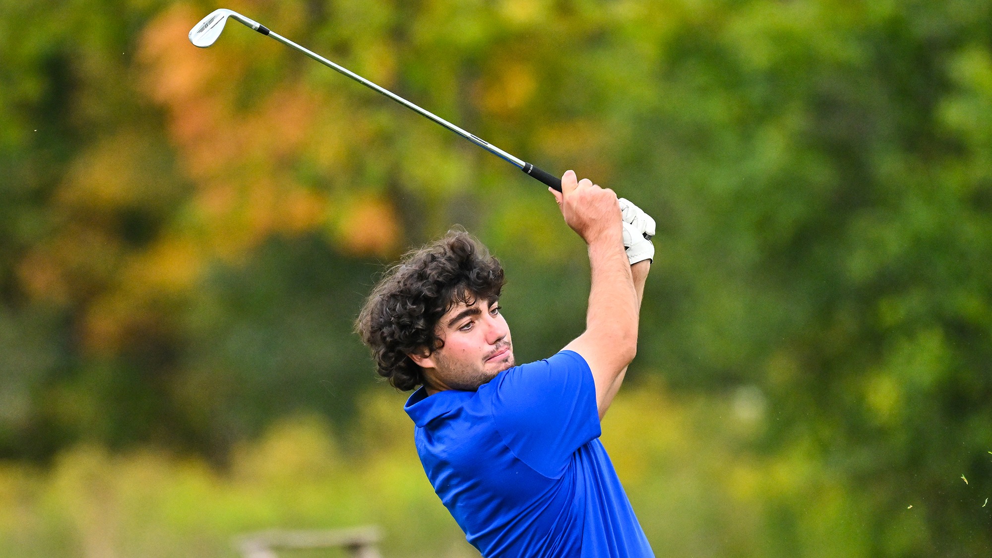 Ramon Aroca Gonzalez watches his iron shot on the driving range during practice in September 2025