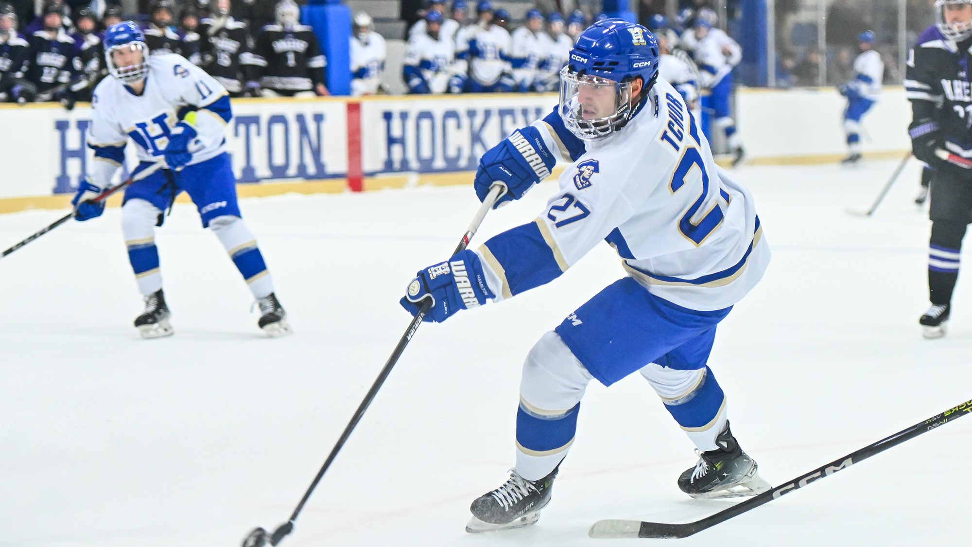 Luke Tchor shoots the puck against Amherst in November 2025