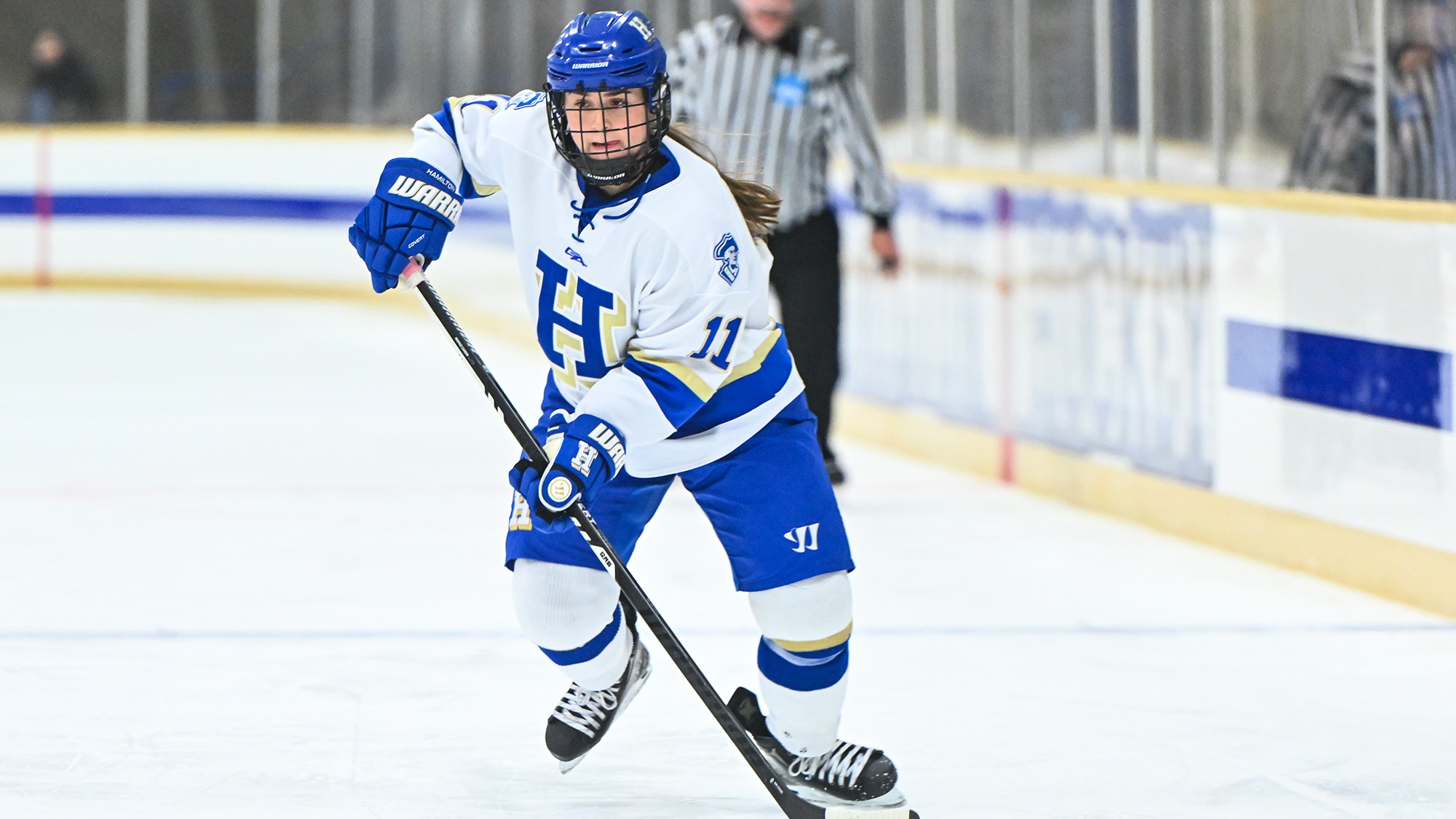Carly McMahon looks to pass the puck in Hamilton's offensive zone against SUNY Canton