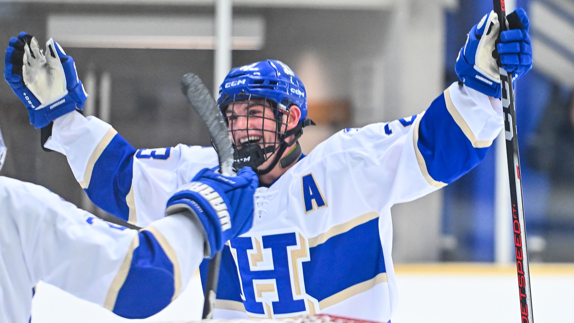 Ben Zimmerman celebrates a men's hockey goal against Conn. College