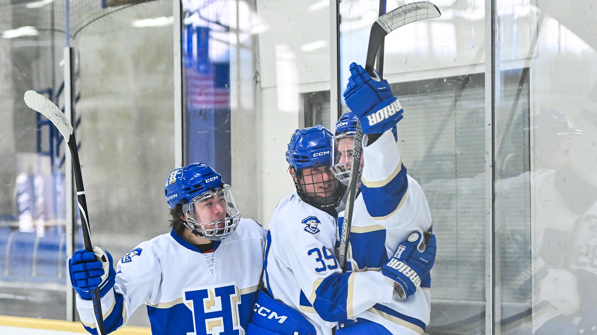 Men's Hockey players celebrate a first-period goal against Connecticut College