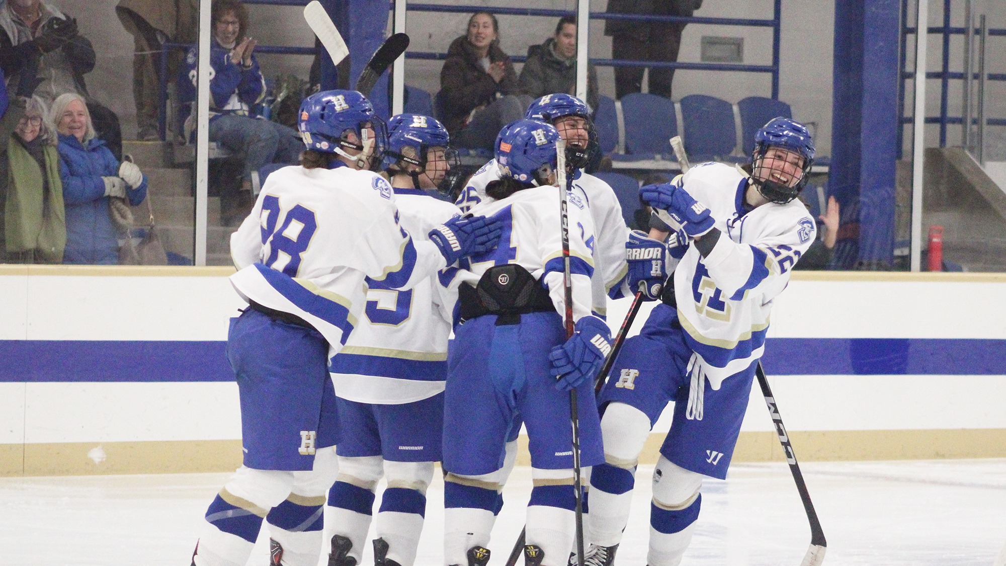 Women's Hockey players celebrate their goal against Connecticut College on Jan. 24