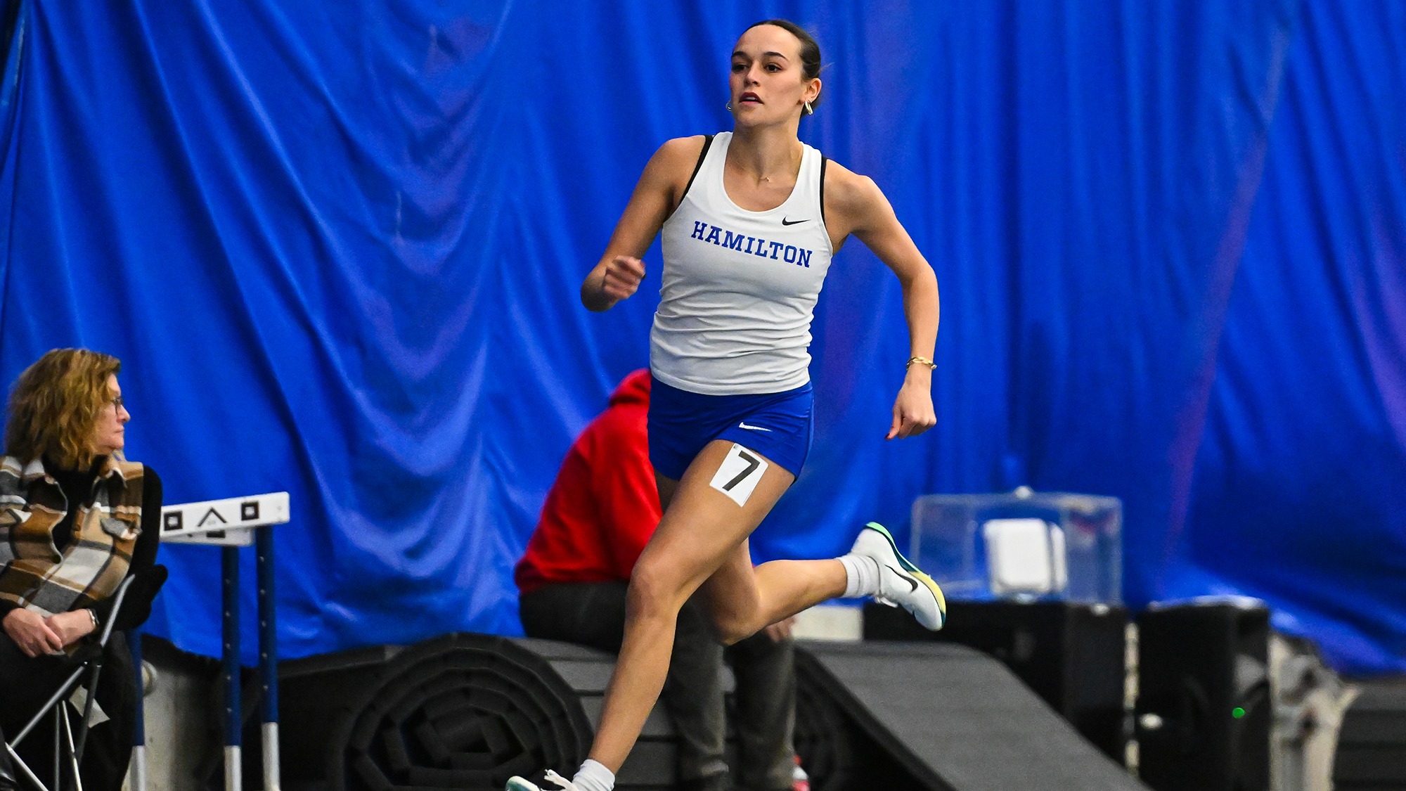 Ruby Austin rounds a turn in the 500 meters at Utica University