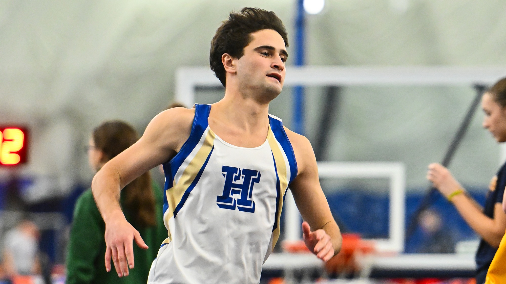 Ellis Goodson runs in the 1,000 meters at Utica University in January 2026