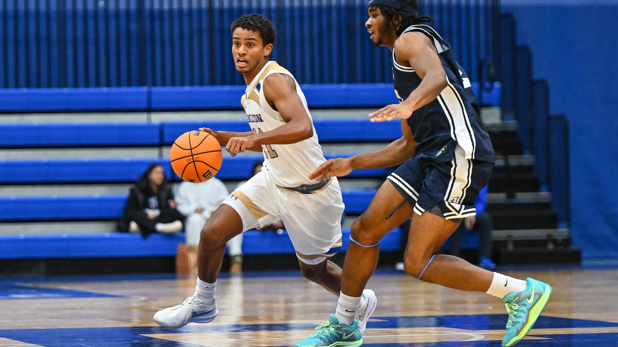Matthew Rideout brings the ball up the court against Ithaca in November 2025