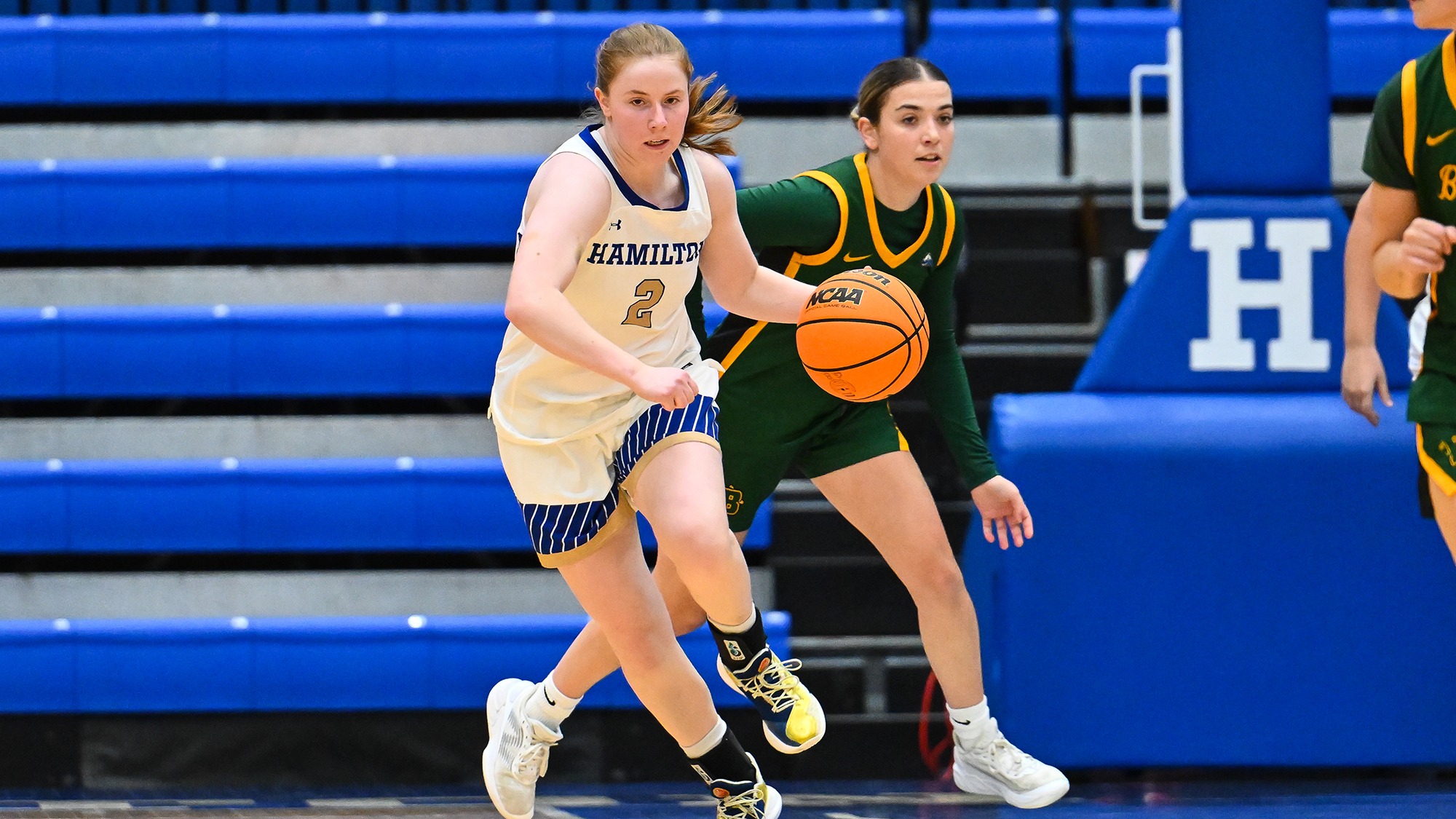 Hannah Bernstein rushes the basketball up the court against SUNY Brockport in November 2025