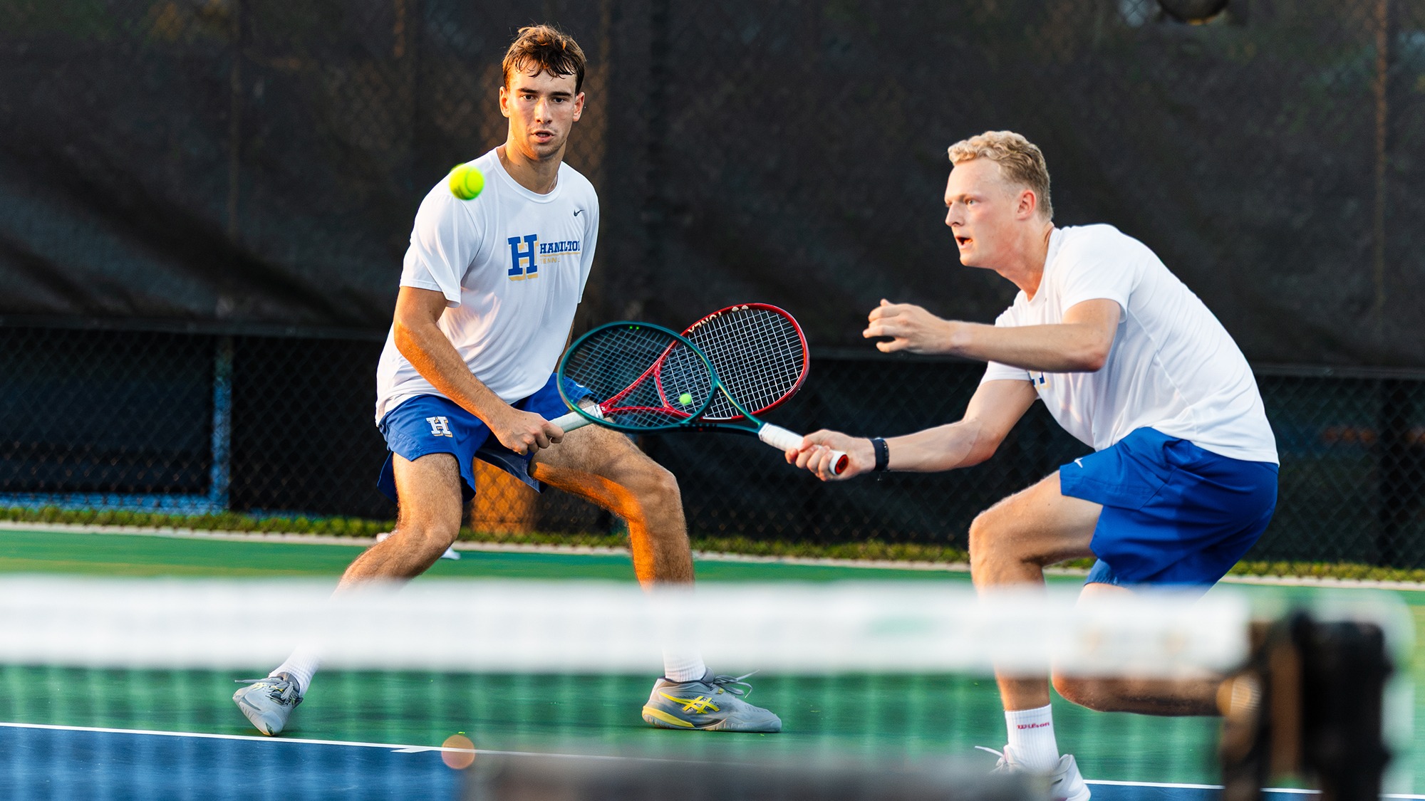 Men's Tennis players Alexei Katelevsky and Filip Moller go for a return in their ITA Cup match