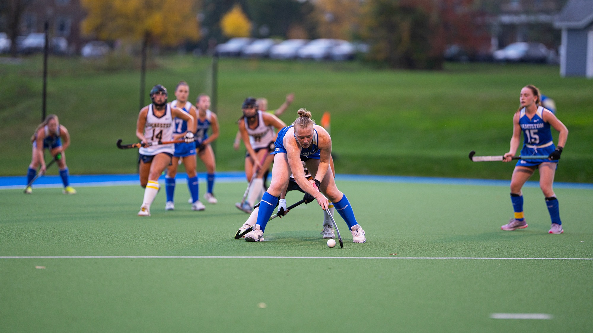 Field Hockey defender Morgan Clarke shields a Rochester player from the ball