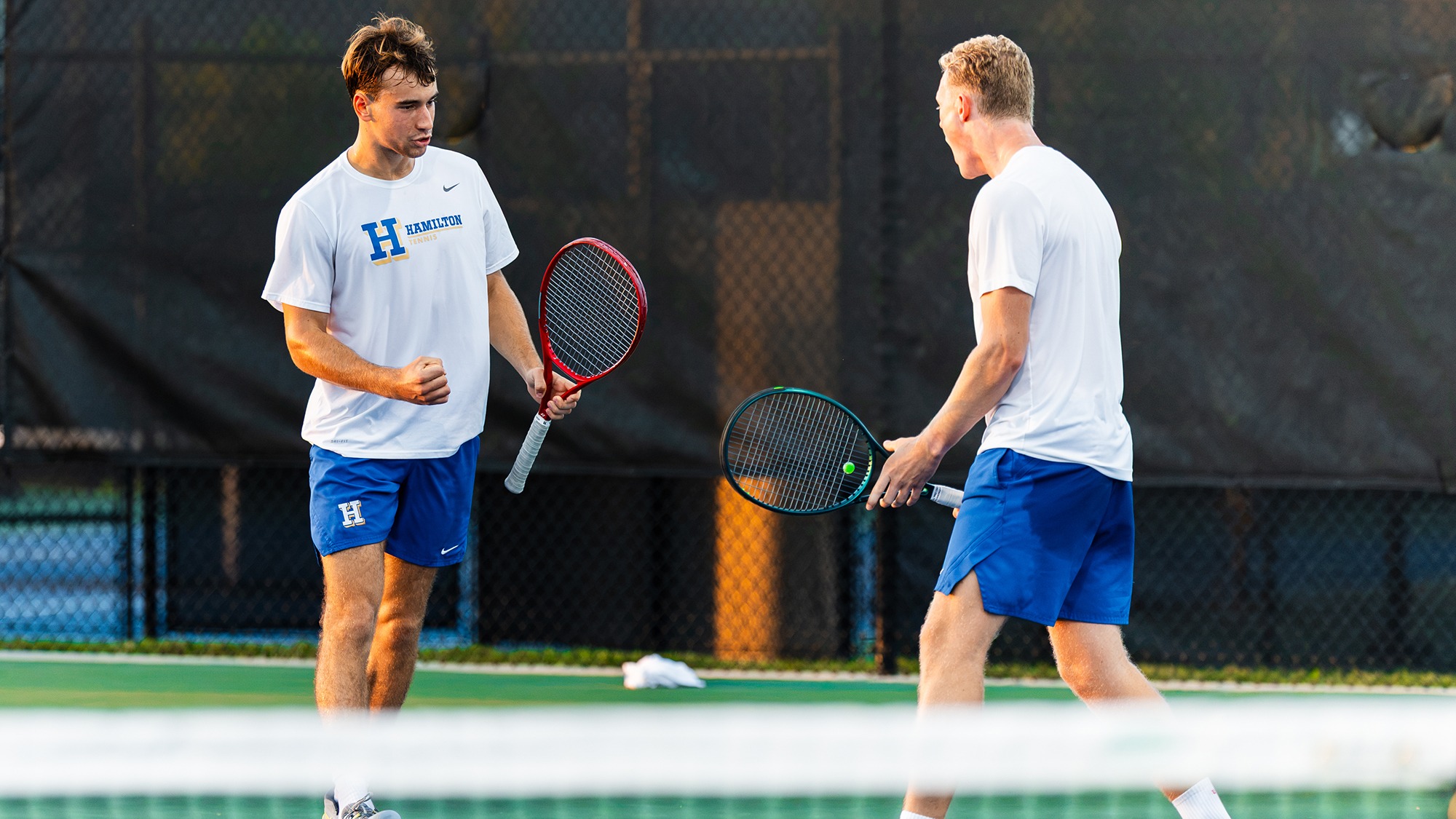Men's Tennis players Alexei Katelevsky and Filip Moller celebrate a point during their ITA Cup match