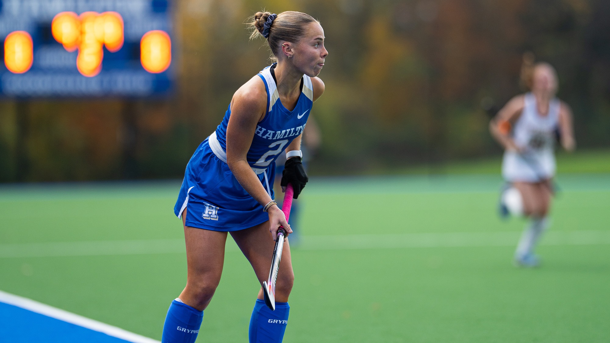Lindsey Piper prepares to put the ball in play from the sideline in a field hockey game with Rochester