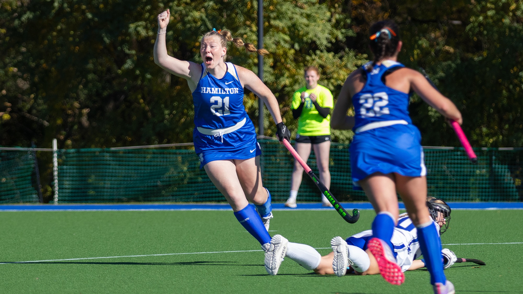 Morgan Clarke celebrates her go-ahead goal in a field hockey matchup with Colby