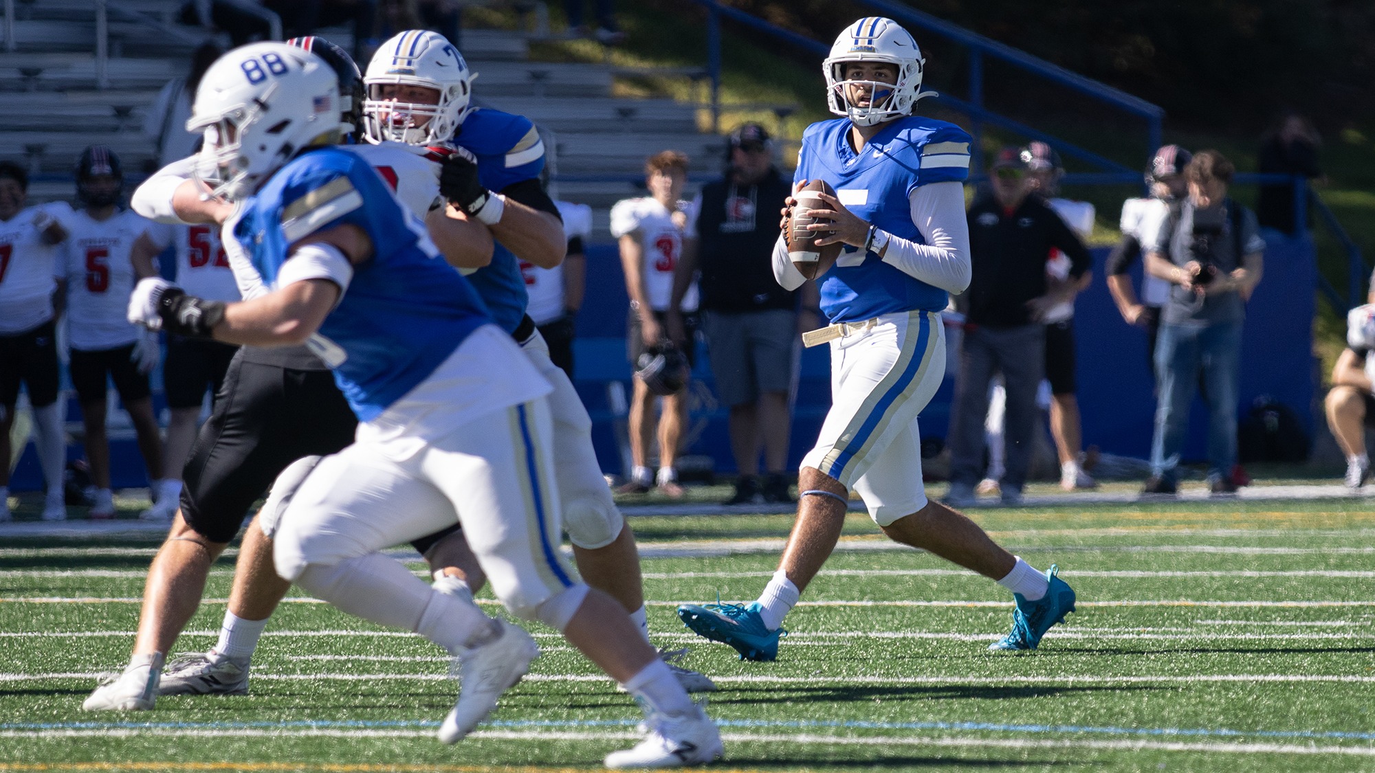 Luke Kurzum looks for someone to pass to in the football game against Wesleyan