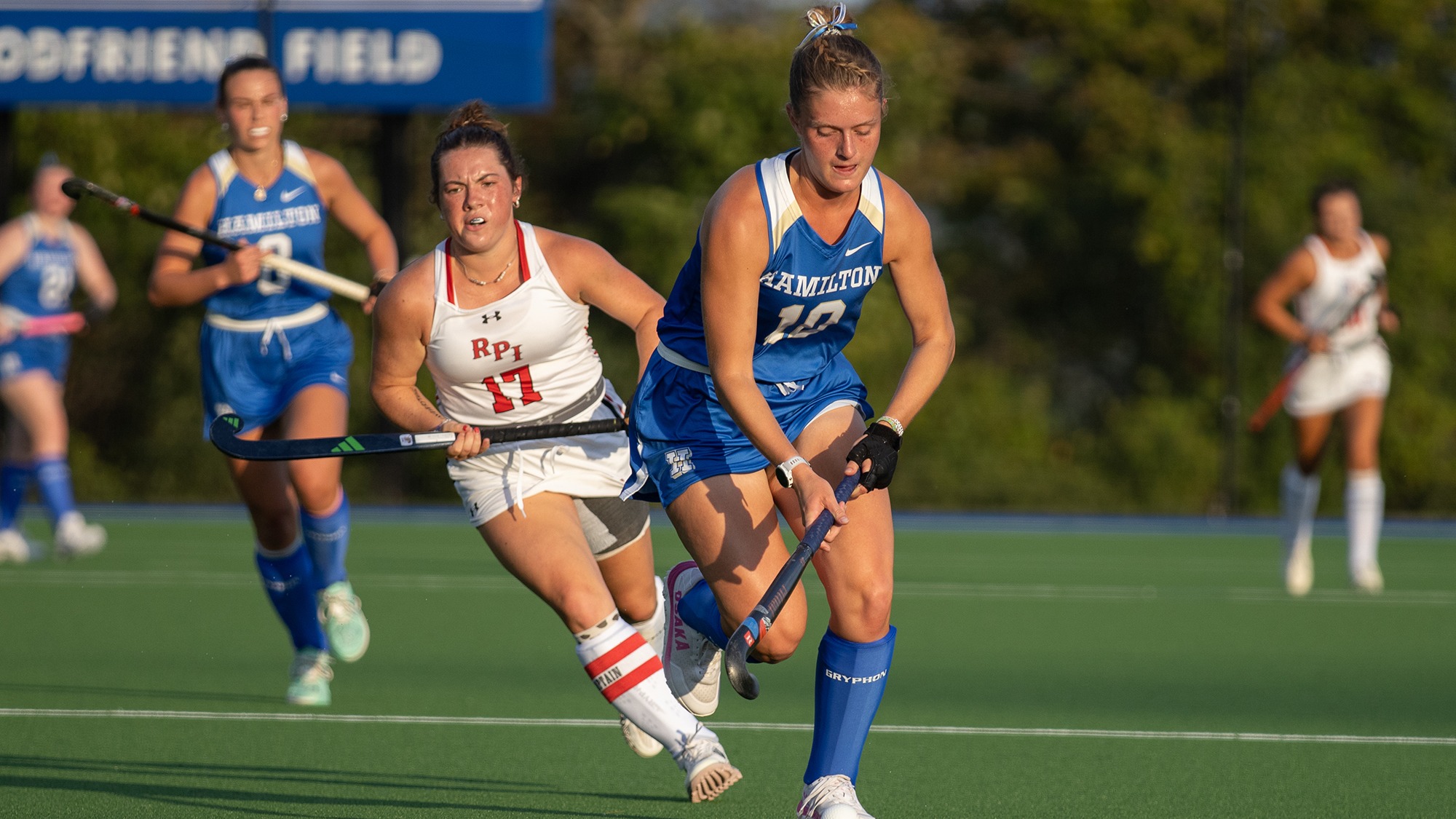 Shaw Huston stickhandles the field hockey ball against RPI