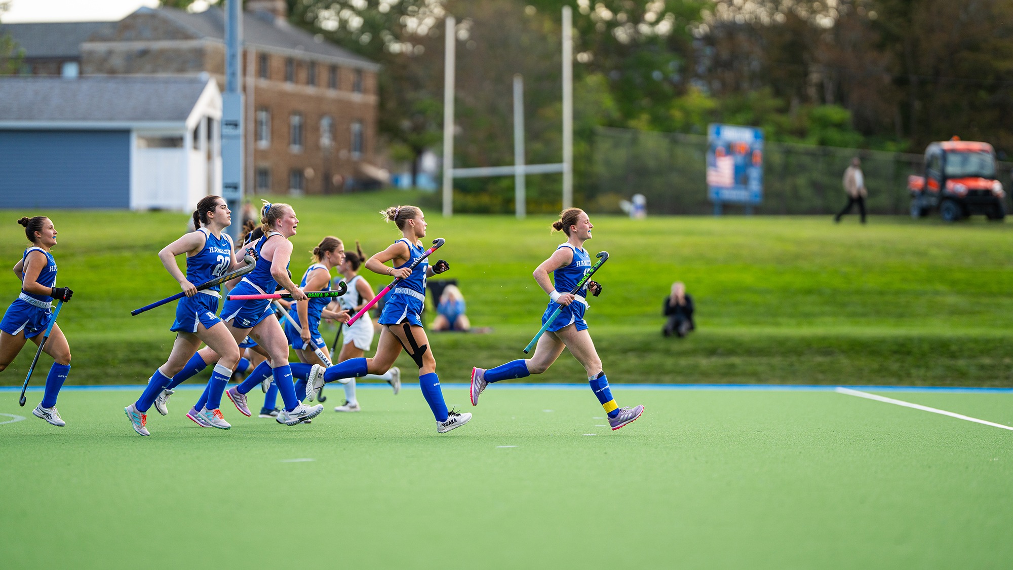 Field Hockey players run back to midfield after scoring a goal against Skidmore