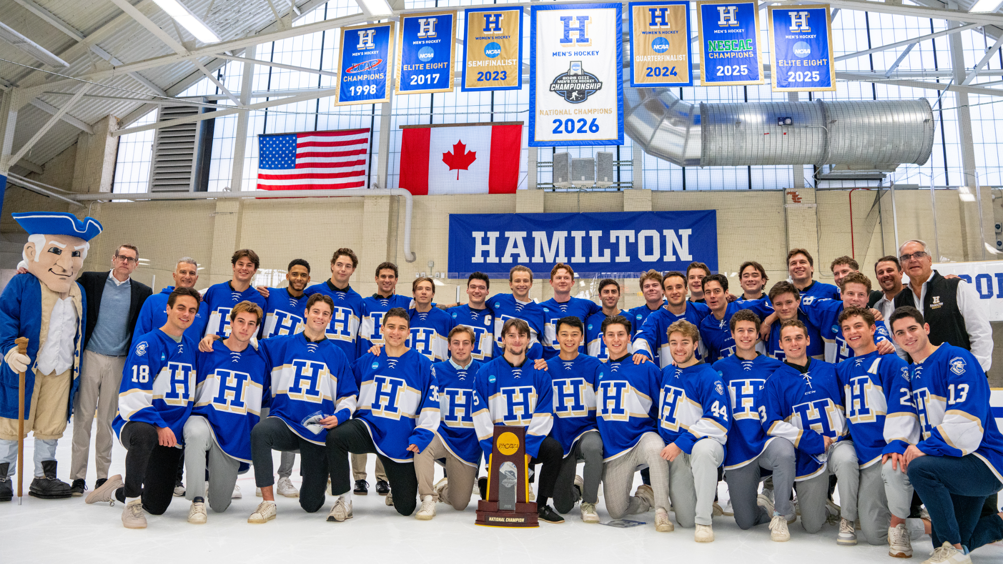 Members of the the Hamilton College Men's Hockey 2026 national championship team poses for a photo on the Sage Rink ice following a championship banner unveiling ceremony on Oct. 3, 2026.