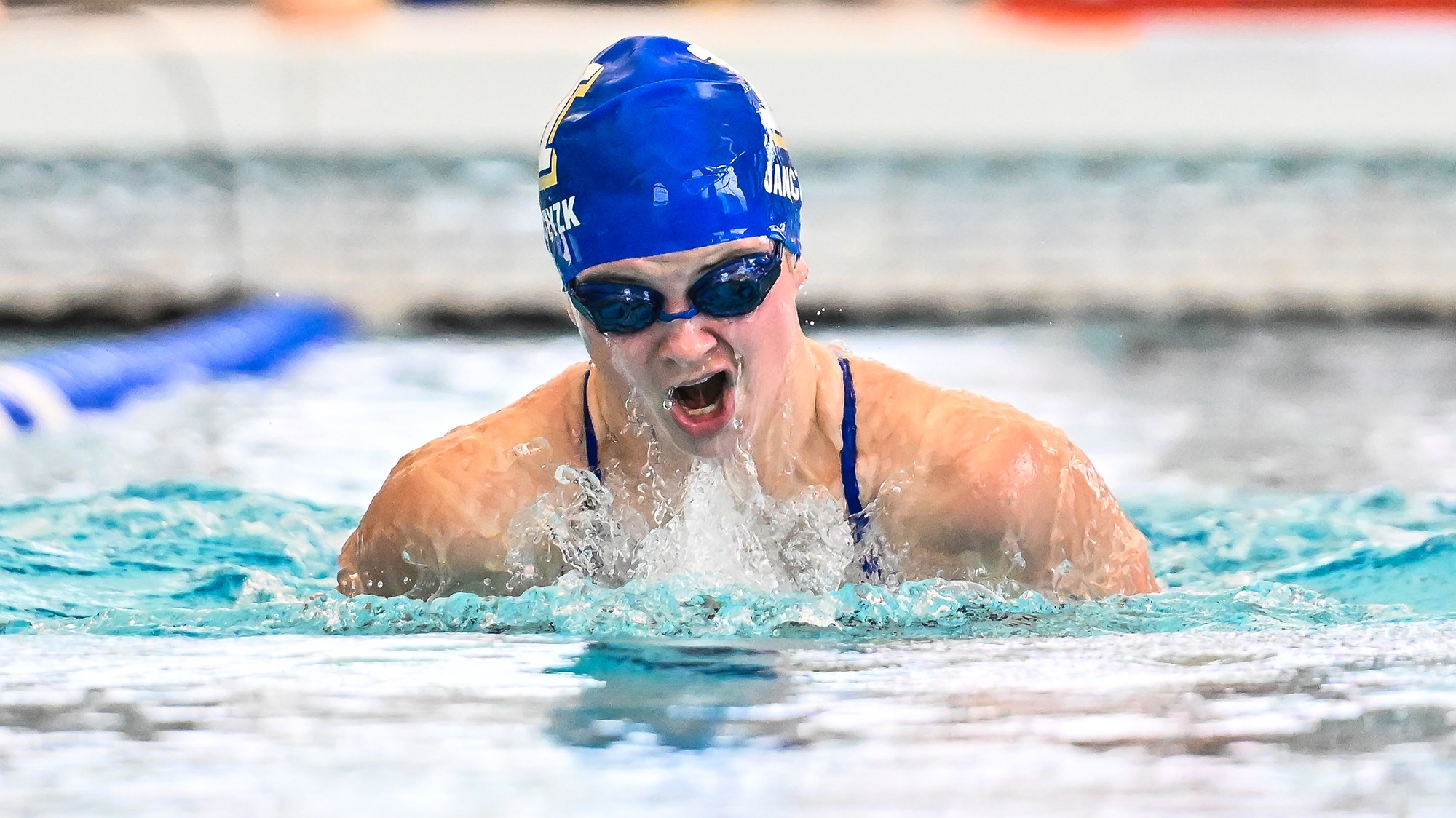 Megan Janczyk comes up for air in the breaststroke in the RIT dual meet