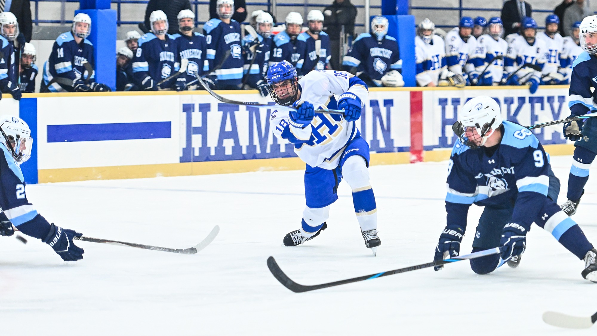 Max Bulawka shoots the hockey puck through traffic against Conn. College