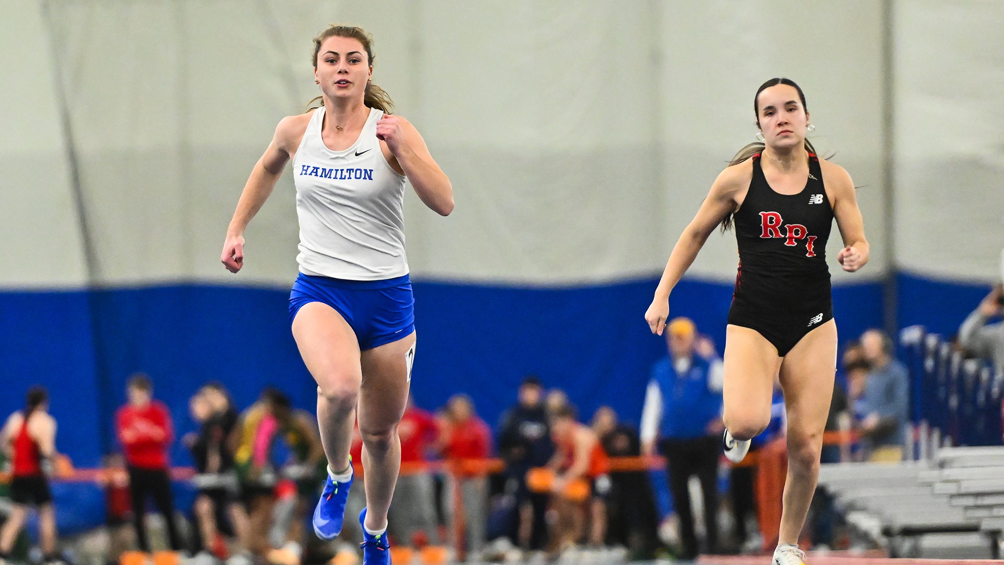 Ava Chiappinelli outraces an RPI athlete in the 60-meter dash at Utica University