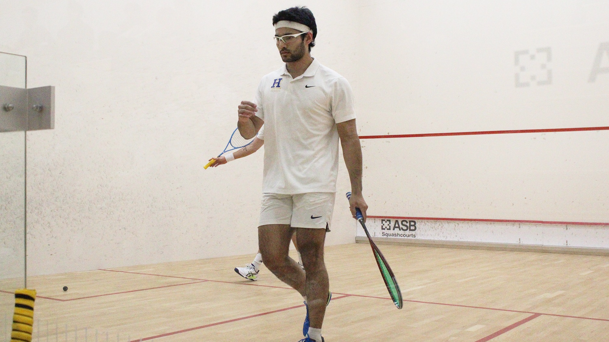 Atreyus Bhavsar pumps his fist after winning a point against Trinity in the NESCAC championship