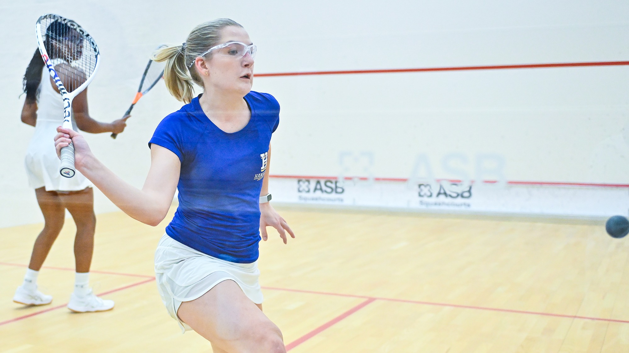 Poppy Huffman hits a forehand return in the Denison match