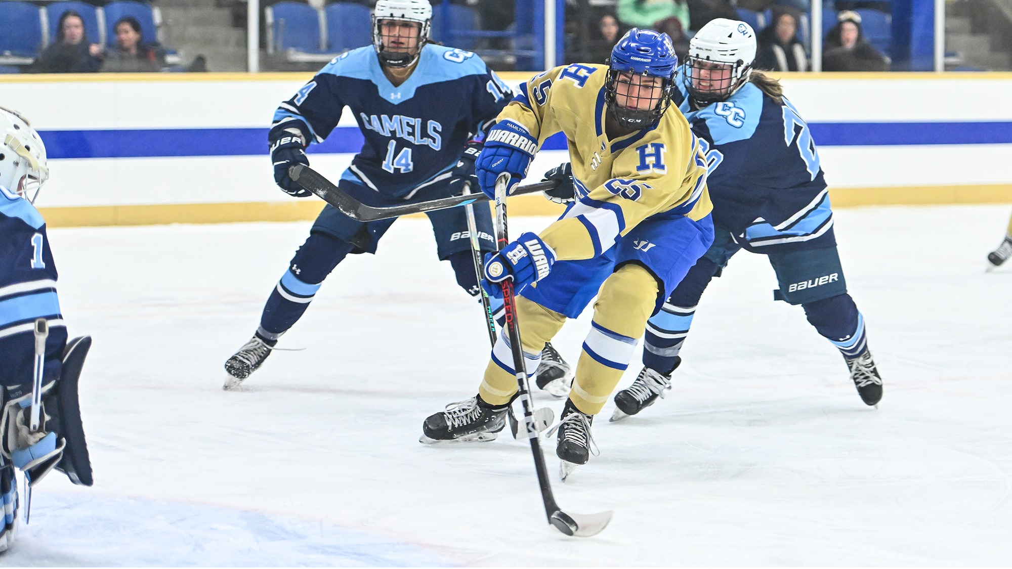 Sarah Myziuk shoots the hockey puck from the low slot against Connecticut College