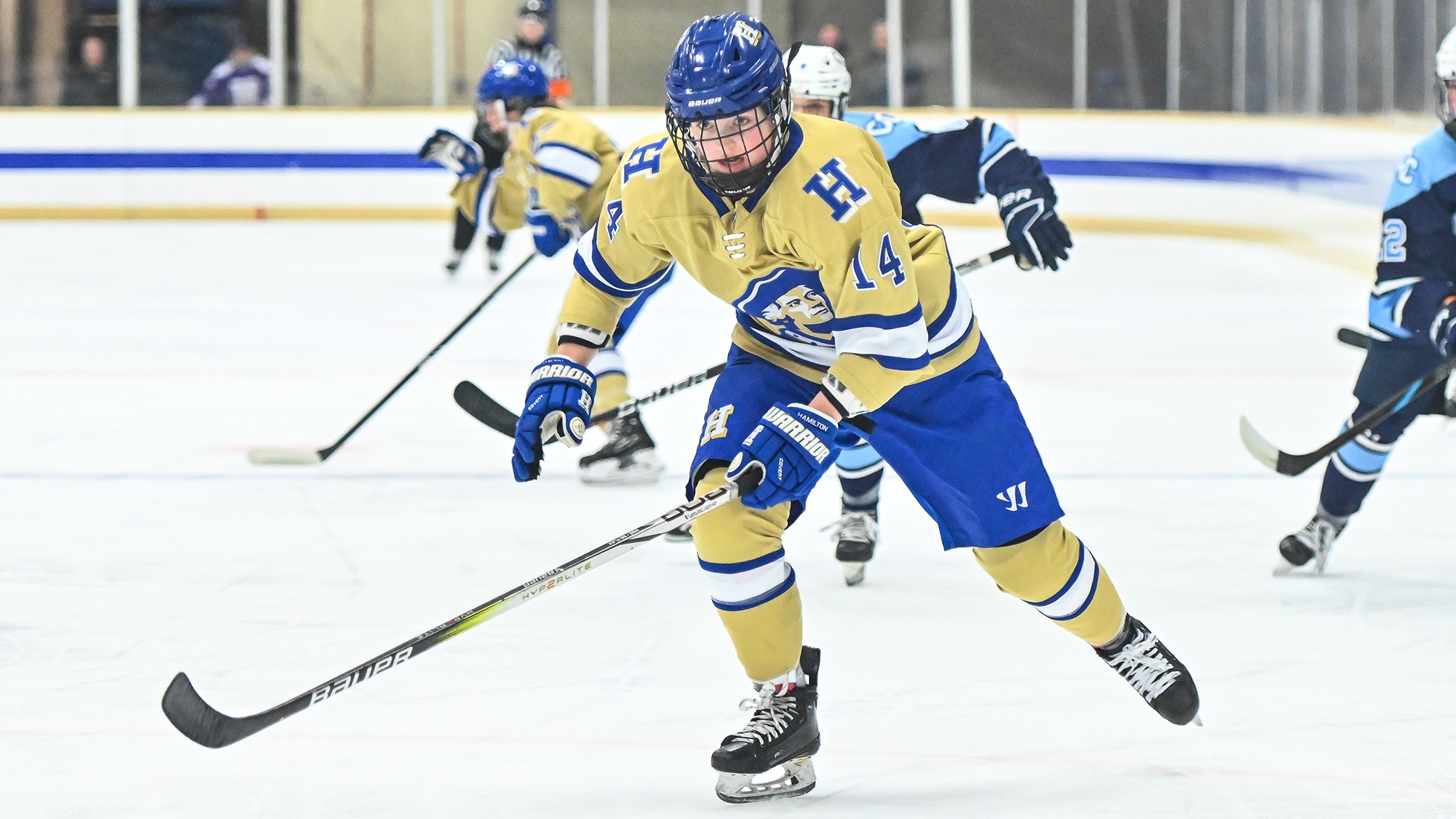Bri Rockwood pursues the hockey puck in her attacking zone against Connecticut College