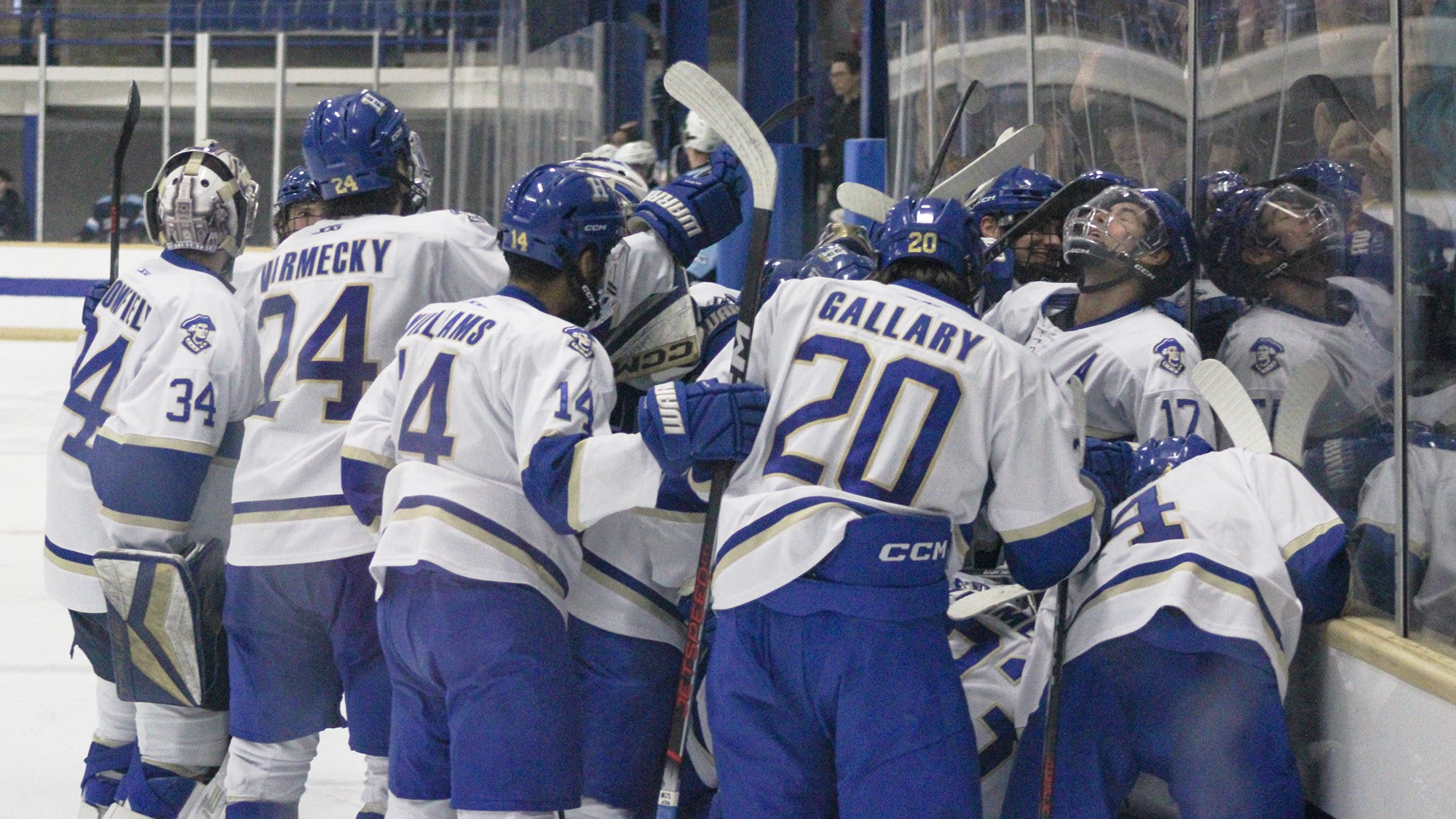 Men's Hockey celebrates their overtime goal against Conn. College in the 2026 NESCAC quarterfinals