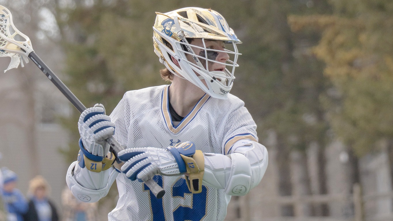 Jesse Delinsky looks to pass the lacrosse ball against Bowdoin in March 2026