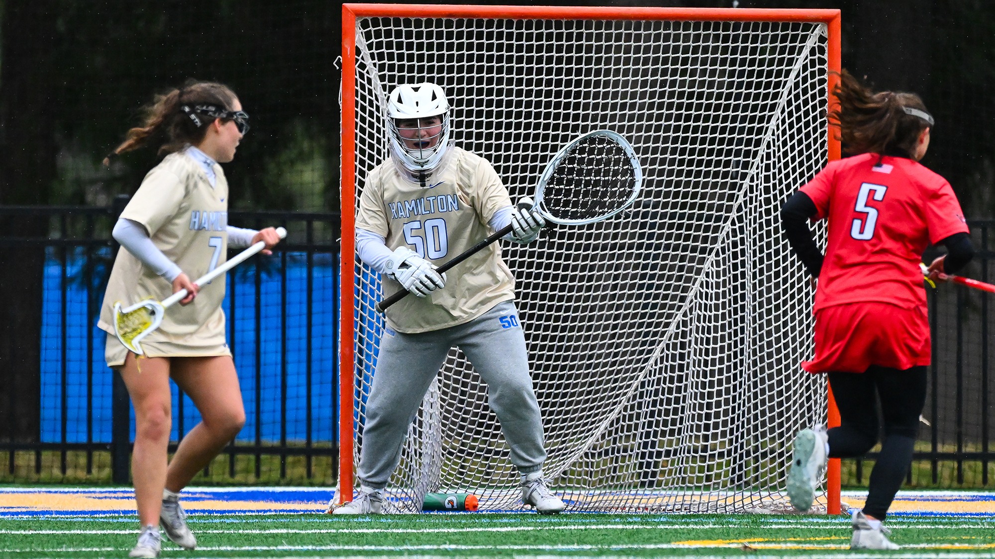 Eliza Schwarz directs the women's lacrosse defense from her crease against Wesleyan